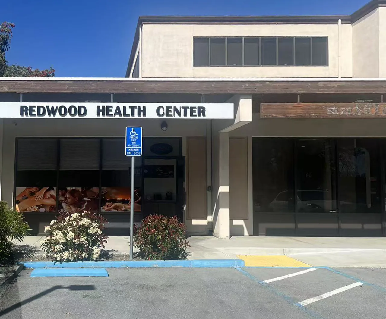 Side view of Redwood Health Center showing the full storefront