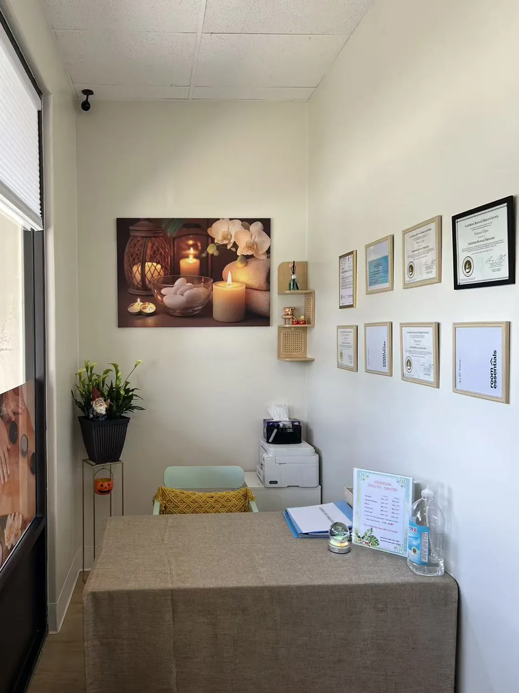Reception area with therapist credentials and licenses framed on the wall